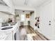 Bright kitchen featuring white appliances, ample cabinet space, and a charming, functional design at 1061 Gaither Nw Pl, Concord, NC 28027