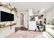 Bright living room featuring wood floors and a charming TV shelf with plenty of natural light at 1061 Gaither Nw Pl, Concord, NC 28027