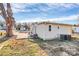 Home's rear exterior view highlights yard and convenient access points at 1061 Gaither Nw Pl, Concord, NC 28027
