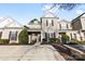 Charming townhome featuring a welcoming facade with neutral siding, dark shutters, and well-maintained landscaping at 11141 Lions Mane St, Charlotte, NC 28273