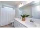 Bathroom featuring a double sink vanity, a mirror, and a shower with a curtain at 11440 Westbranch Pkwy, Davidson, NC 28036