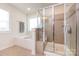 Bathroom features a separate shower and bathtub, along with neutral-toned tiles and a window at 11440 Westbranch Pkwy, Davidson, NC 28036