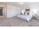 Comfortable bedroom with a well-appointed bed, neutral decor, and ample natural light at 11440 Westbranch Pkwy, Davidson, NC 28036