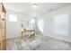 Bright bedroom featuring neutral walls, plush carpet, and natural light from multiple windows at 11440 Westbranch Pkwy, Davidson, NC 28036