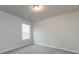 Bedroom features neutral walls and carpet with a single window offering natural light at 11440 Westbranch Pkwy, Davidson, NC 28036