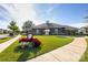 Community clubhouse with lush landscaping and a manicured lawn at 11440 Westbranch Pkwy, Davidson, NC 28036