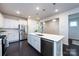 Bright kitchen with white cabinetry, stainless steel appliances, and pendant lighting at 11440 Westbranch Pkwy, Davidson, NC 28036