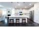 Stylish kitchen with a large island, stainless steel appliances, and pendant lights offers ample space at 11440 Westbranch Pkwy, Davidson, NC 28036