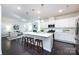Open-concept kitchen features a large island with pendant lighting and stainless steel appliances at 11440 Westbranch Pkwy, Davidson, NC 28036