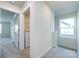 Upstairs hallway featuring a laundry closet with a washer and dryer at 11440 Westbranch Pkwy, Davidson, NC 28036