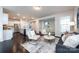 Spacious living room seamlessly connecting to the kitchen and dining area at 11440 Westbranch Pkwy, Davidson, NC 28036
