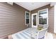 Covered patio with stylish seating and view of backyard at 11440 Westbranch Pkwy, Davidson, NC 28036