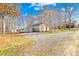 View of the home's exterior showing the well-maintained gravel driveway and yard at 120 Roger Dr, Statesville, NC 28625