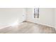 Cozy bedroom with wood floors and a large window for natural light at 120 Roger Dr, Statesville, NC 28625