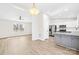 Bright, modern kitchen features stainless steel appliances, white cabinets, gray island, and backyard view at 120 Roger Dr, Statesville, NC 28625
