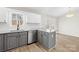 Updated kitchen with stainless steel appliances, granite counters, modern faucet, and view of the back yard at 120 Roger Dr, Statesville, NC 28625