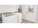 Modern laundry room featuring new washer and dryer, and access to the outside at 120 Roger Dr, Statesville, NC 28625