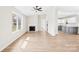 Inviting living room featuring a fireplace, large windows, and wood flooring at 120 Roger Dr, Statesville, NC 28625