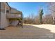 Expansive backyard features a deck and fresh straw; an outdoor oasis perfect for relaxation and entertaining at 1324 Southampton St, Shelby, NC 28152