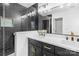 Elegant bathroom with a double vanity, quartz countertops, and modern black tiling in the glass shower enclosure at 1324 Southampton St, Shelby, NC 28152