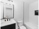 Modern bathroom featuring a white tile shower/tub combo, new toilet, and modern vanity with quartz countertop at 1324 Southampton St, Shelby, NC 28152