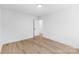 Spacious bedroom with wood flooring, light walls, and natural light; door leads to adjoining room at 1324 Southampton St, Shelby, NC 28152