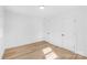 A bright bedroom with hardwood floors and two doors at 1324 Southampton St, Shelby, NC 28152