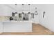 Stylish eat-in kitchen island with modern pendant lighting, stainless appliances and hardwood floors at 1324 Southampton St, Shelby, NC 28152