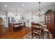 Bright kitchen with granite countertops, stainless steel appliances, and island adjacent to breakfast area at 1336 College Ave, Shelby, NC 28152