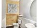 Charming powder room with stylish wood accent wall and decorative mandala art at 13529 Browhill Ln, Charlotte, NC 28278