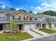 Charming townhomes with well-manicured lawns, individual driveways, attached garages, and diverse color schemes at 13529 Browhill Ln, Charlotte, NC 28278