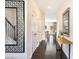 Bright hallway with dark hardwood floors and decorative mirrors leading into the living area at 13529 Browhill Ln, Charlotte, NC 28278