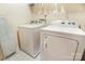 Functional laundry room with washer, dryer, and ample space for storage at 13529 Browhill Ln, Charlotte, NC 28278