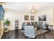 Comfortable living room showcasing a modern light fixture, a stylish couch with pillows, and a geometric-patterned rug at 13529 Browhill Ln, Charlotte, NC 28278