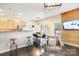 Inviting living area featuring hardwood floors, modern lighting, and a stylish accent wall open to the dining area and kitchen at 13529 Browhill Ln, Charlotte, NC 28278