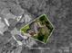 Aerial view showcasing the property's location and borders in a lush, tree-filled neighborhood at 13822 Tributary Ct, Davidson, NC 28036
