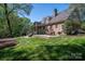 Well-maintained backyard with a deck and ample space for outdoor activities at 13822 Tributary Ct, Davidson, NC 28036