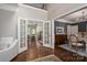 Grand foyer with hardwood floors, high ceilings, open staircase and large french doors leading into living spaces at 13822 Tributary Ct, Davidson, NC 28036