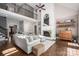 Spacious living room with hardwood floors, a vaulted ceiling and a charming white brick fireplace at 13822 Tributary Ct, Davidson, NC 28036
