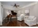 Cozy living room featuring hardwood floors, a ceiling fan and comfortable seating perfect for relaxation at 13822 Tributary Ct, Davidson, NC 28036