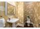 Charming powder room with floral wallpaper, pedestal sink, and modern toilet at 13822 Tributary Ct, Davidson, NC 28036