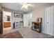 Comfortable bedroom with an adjacent bathroom entrance and carpet floors at 140 Reid Ln, Pineville, NC 28134