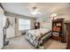 Comfortable bedroom with a ceiling fan, window, and carpet flooring at 140 Reid Ln, Pineville, NC 28134