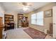 Versatile bedroom space with natural light, bookshelves, and neutral decor at 140 Reid Ln, Pineville, NC 28134