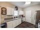 Modern kitchen with stainless steel appliances, gray countertops, and white cabinetry for a clean, stylish look at 140 Reid Ln, Pineville, NC 28134