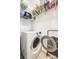 Functional laundry area with a front-load washing machine and ample storage at 140 Reid Ln, Pineville, NC 28134