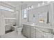 Beautiful bathroom with double sink vanity, a glass-enclosed shower and tile flooring at 14012 Felix Ln # 7, Charlotte, NC 28277