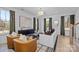 Bright living room with contemporary furnishings, large windows, and stylish decor at 14012 Felix Ln # 7, Charlotte, NC 28277