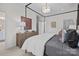 Comfortable main bedroom with a four-poster bed and a view into a closet at 14012 Felix Ln # 7, Charlotte, NC 28277