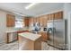 This kitchen features stainless steel appliances and ample counter space for cooking and entertaining at 1404 Peachcroft Rd, Charlotte, NC 28216